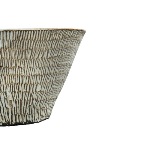 Close-up of hand-carved radiating lines on Hedgehog Bowl, Mocha Cat Pottery