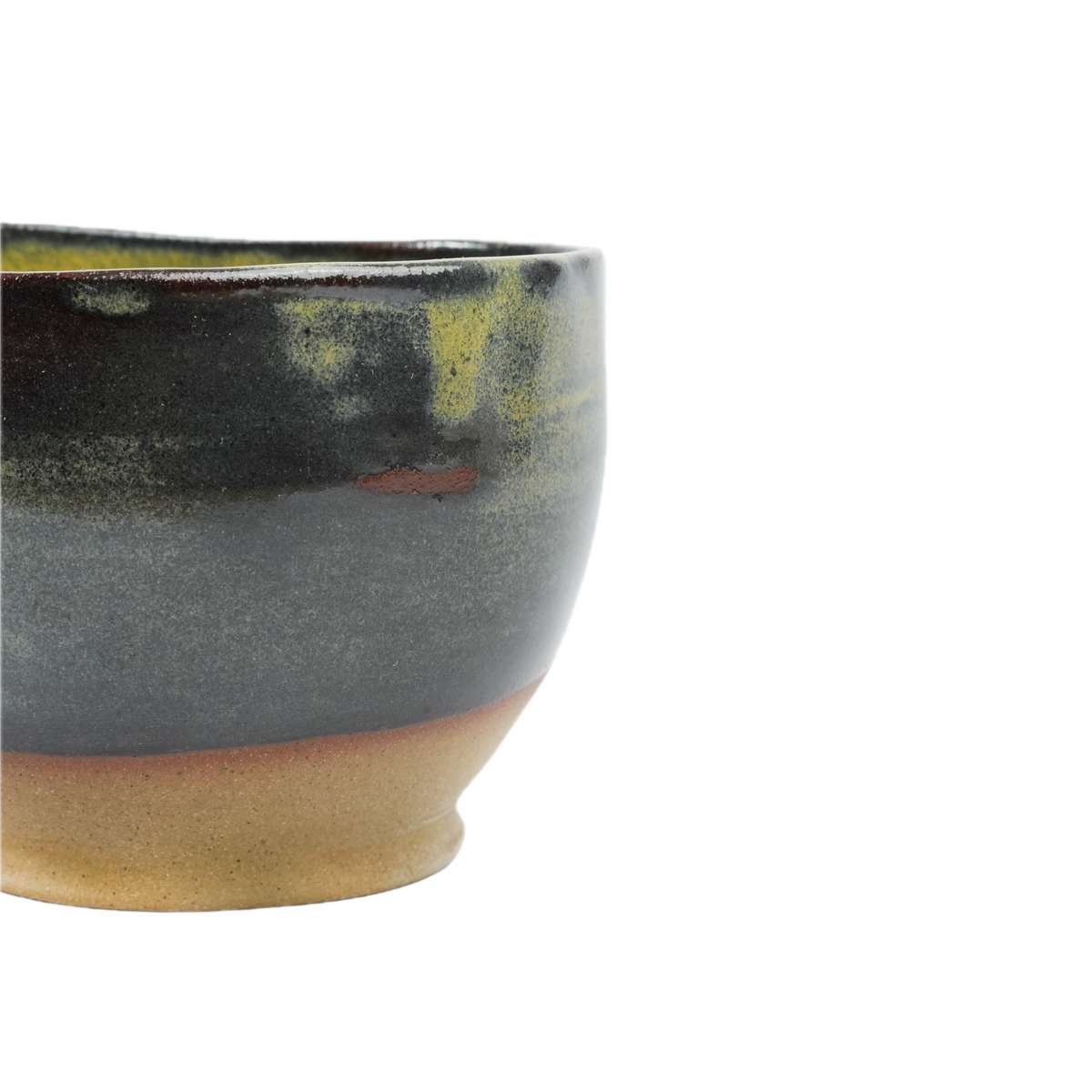 Detail of dripping glaze on wheel-thrown stoneware cup, Mocha Cat Pottery
