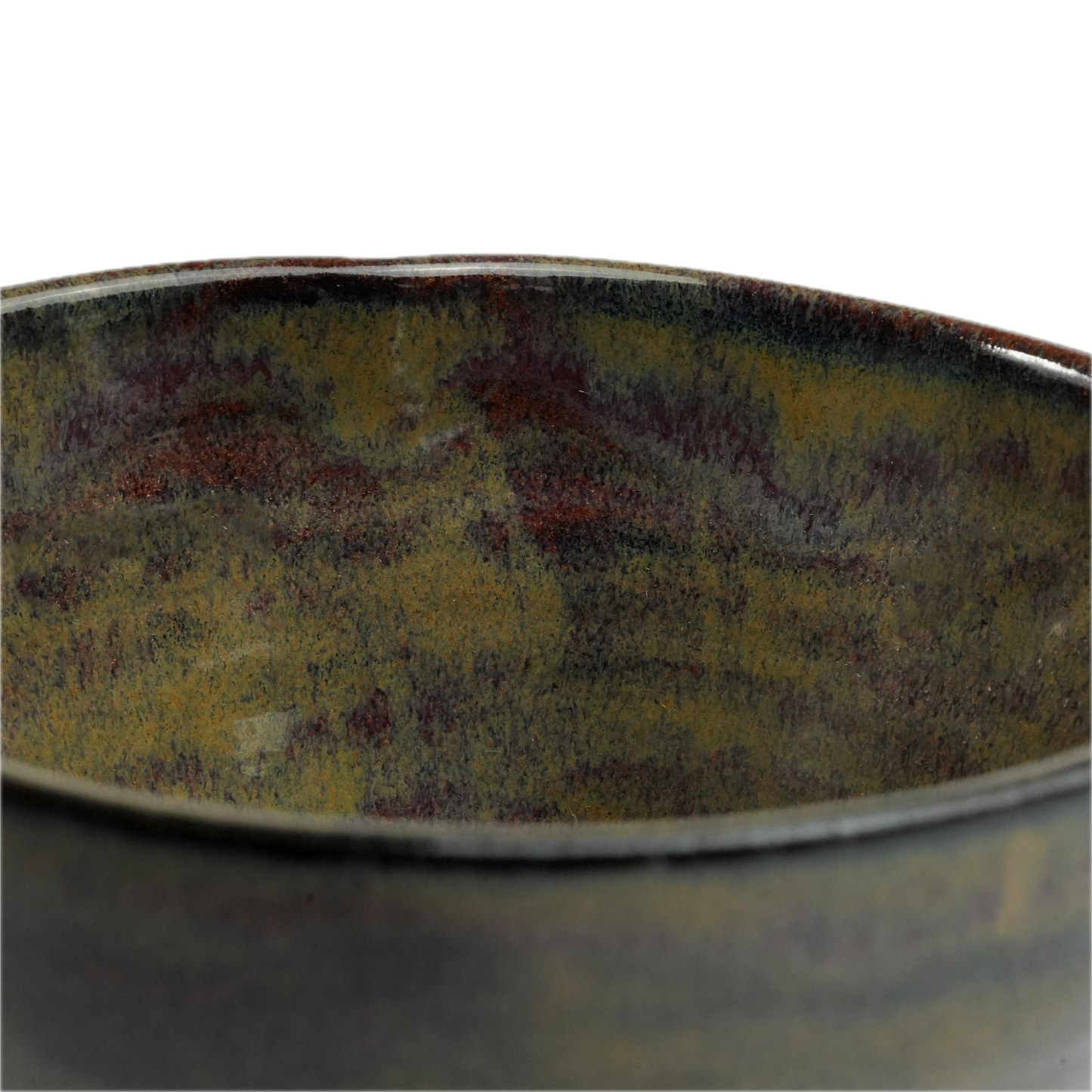 Close-up of iridescent glaze texture on handmade stoneware bowl