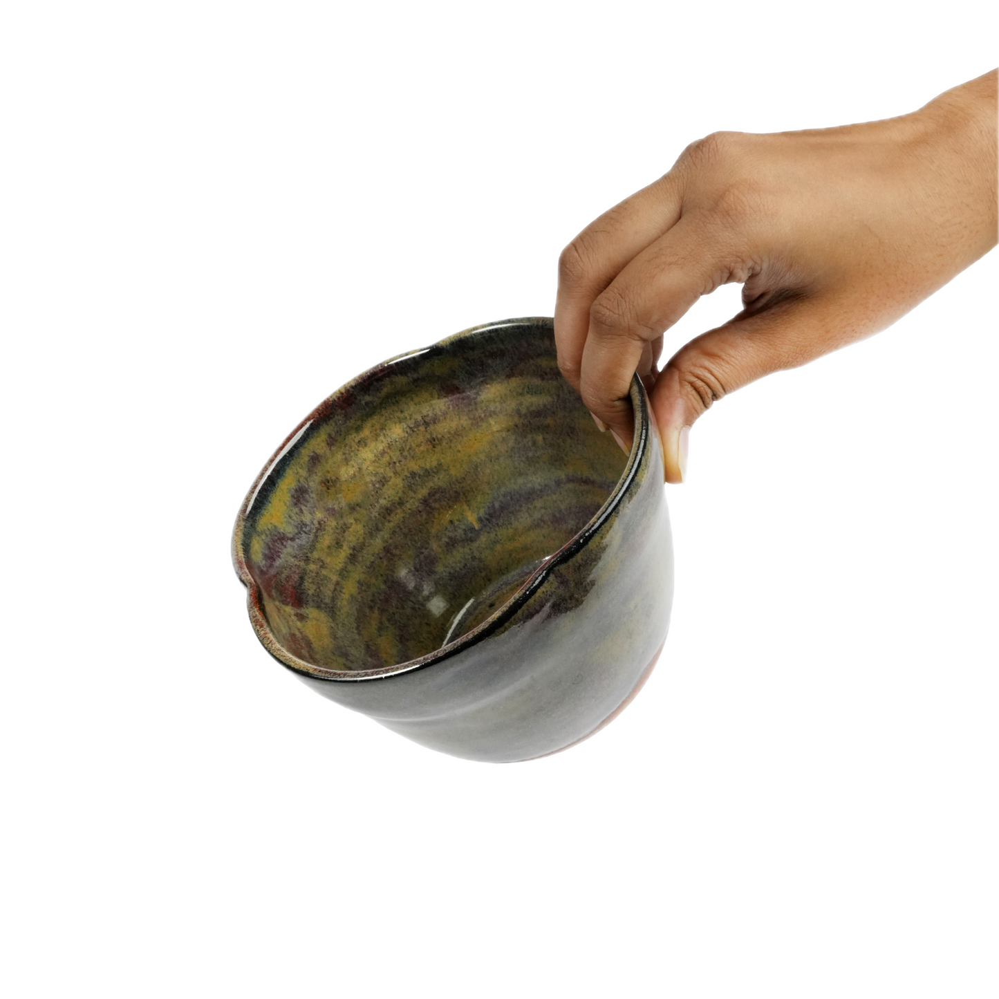Iridescent bowl shown next to hand